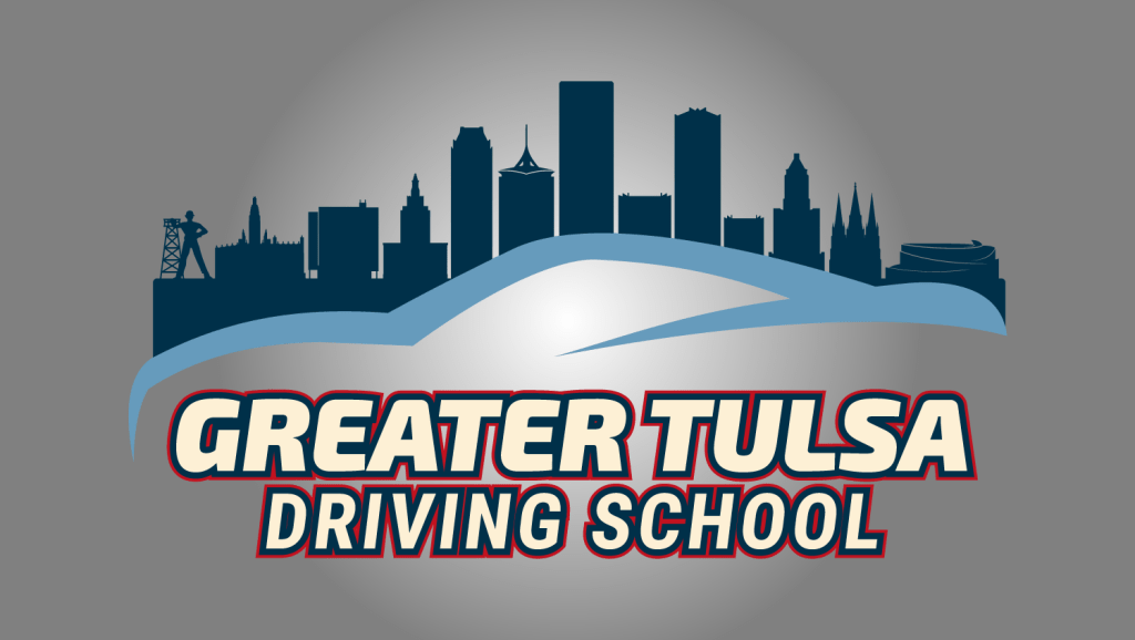 Greater Tulsa Driving School logo featuring the Tulsa city skyline with the Golden Driller statue, a blue car silhouette, and bold text in cream, navy, and red.